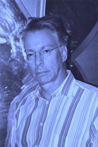 Lee Froehlich, a man wearing a striped shirt.