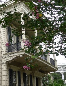 A white building with a balcony.