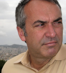 A man wearing a tan shirt.