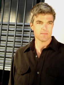 A man wearing a black shirt.